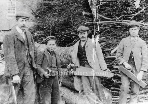 Old Photo, 3 men and a boy displaying wood working tools at Long's yard in Aston.