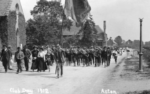 Club Day in the year 1912, procession with with flag waving and a band playing, along the Cote Road in Aston.