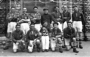 Old photo of Aston's Football Team and Mascot.