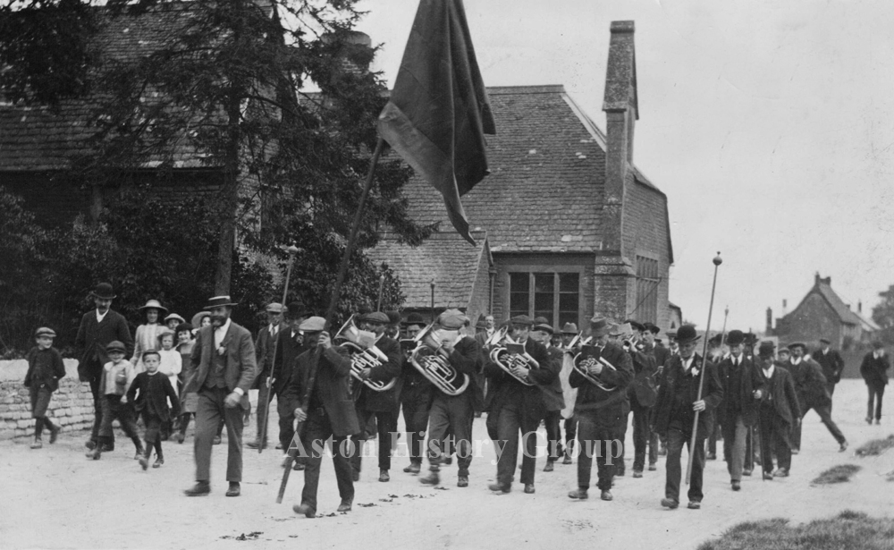 Cote Road Aston, Club Day in the early 20th century with a procession and band playing.