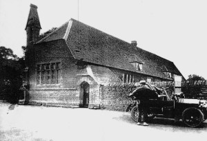 Old photograph, The Aston school exterior with vintage car in 1905.