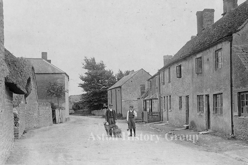 Old photo of 2 men with their dogs in Bull Street, Aston.
